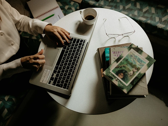 writer working with glasses and laptop